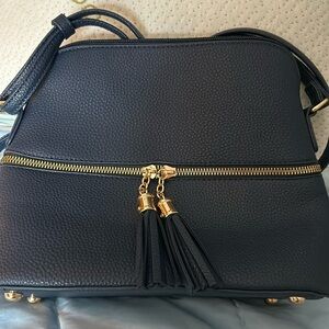 Dressy Navy adjustable strap cross-body purse with stylish front zipper tassels